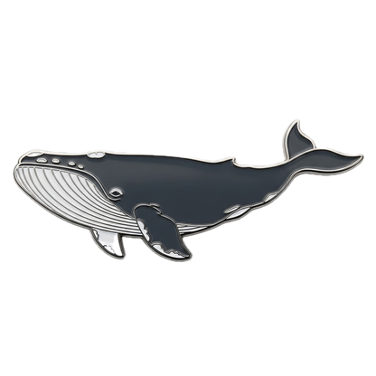 Enamel pin of a whale on a white background